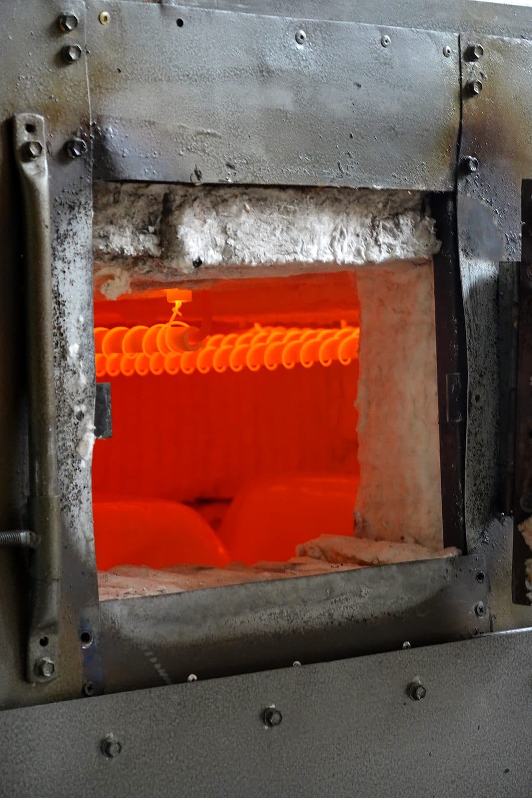 Inside a glowing glass kiln