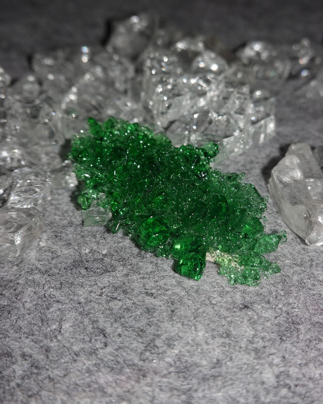 Green glass after firing in the kiln, on grey felt